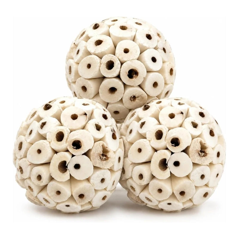 Three round natural bone dog chew toys arranged in a pyramid on a white background.