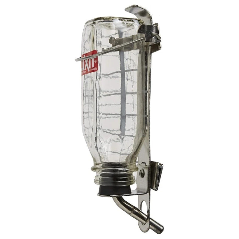 A vintage-style clear glass bottle mounted on a silver metal clip frame, with a small red label on the bottle, shown against a plain white background.
