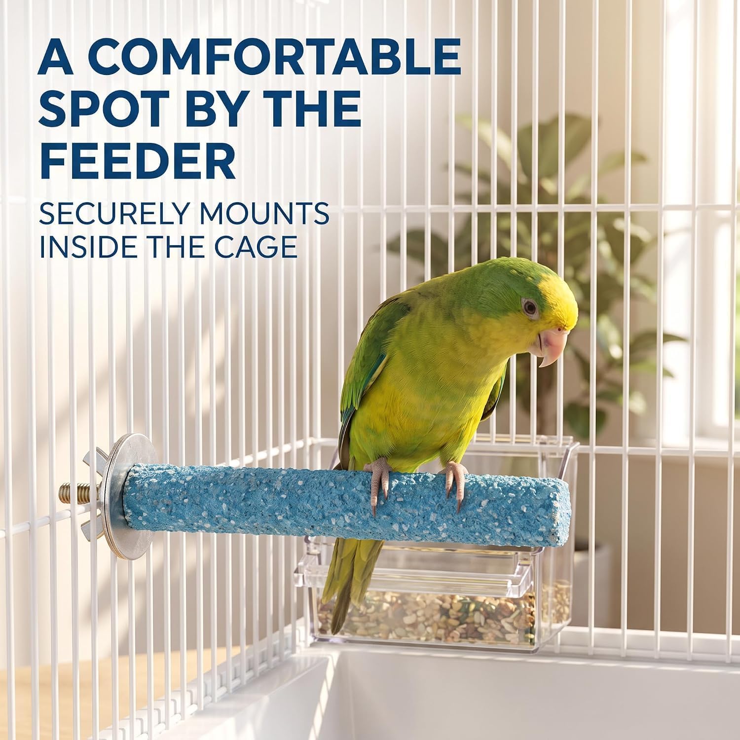 A green and yellow parrot perched on a blue textured bird perch mounted inside a white wire cage, with a clear feeder below. Large text at the top reads, 'A COMFORTABLE SPOT BY THE FEEDER SECURELY MOUNTS INSIDE THE CAGE.